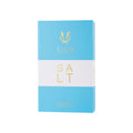 Rectangular blue Ellis Brooklyn Salt Eau de Parfum box with a white horizontal stripe, featuring gold logos and the text SALT EAU DE PARFUM 100 ML 3.4 FL OZ, evoking the essence of salty skin.