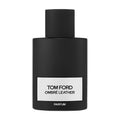 A matte black Ombre Leather Parfum bottle with a silver label, evoking notes of black leather and violet leaf.