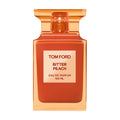 Square glass Tom Ford Bitter Peach Eau de Parfum bottle with a nectar-colored, orange-tinted cap and a label that reads 100 ML.