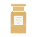 A gold square Tom Ford Soleil Brûlant Eau de Parfum bottle featuring amber and orange flower notes, with a white center label displaying the product name, scent type, and volume.