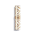 Closed Phyto-Rouge Shine lipstick tube with a white and gold zebra stripe pattern, offering an intense lipstick finish.