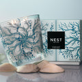 Lifestyle image of Nest Ocean Mist & Sea Salt Decorative Luxury Candle variant: 47.3 oz (Luxury)