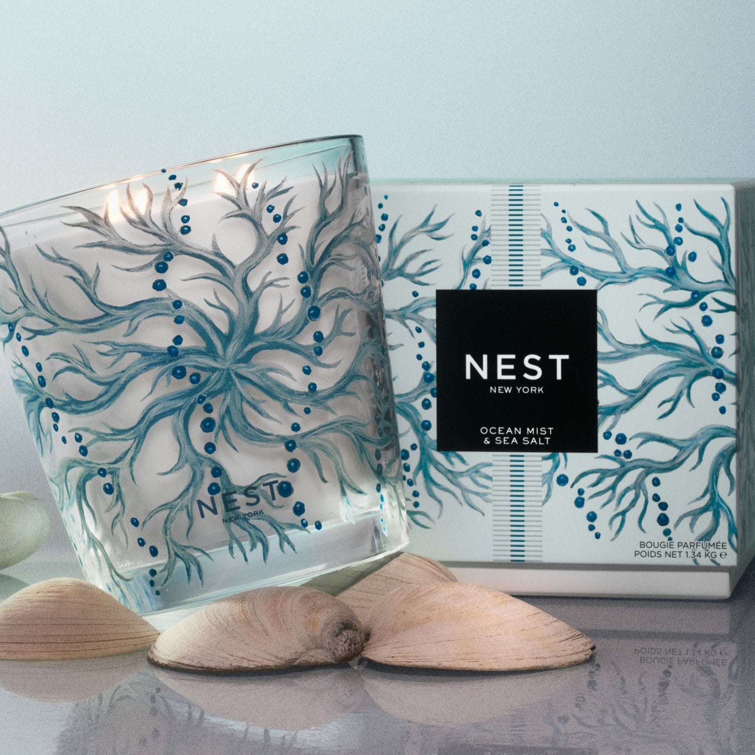 Lifestyle image of Nest Ocean Mist & Sea Salt Decorative Luxury Candle variant: 47.3 oz (Luxury)