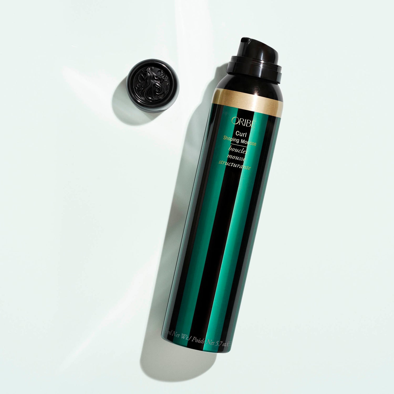 Lifestyle image of Oribe Curl Shaping Mousse variant: 5.7 oz