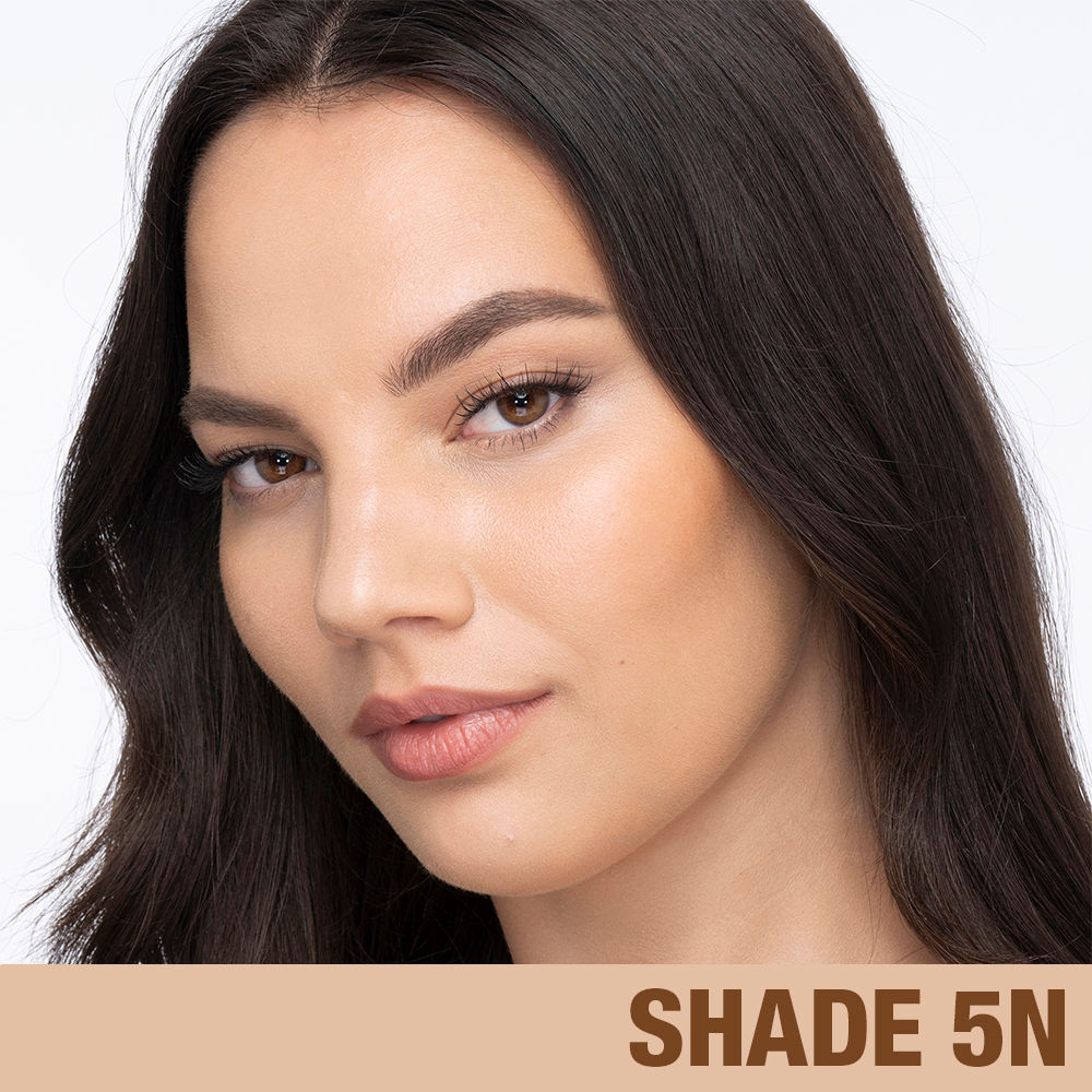 Model image of Charlotte Tilbury  Charlotte's Beautiful Skin Foundation variant: 5 Neutral (fair medium with neutral olive undertones)