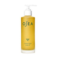 A clear glass pump bottle of OSEA Undaria Algae Body Oil filled with seaweed-infused golden oil for deep moisturization.