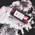 Lifestyle image of R+Co Rodeo Star Thickening Style Foam variant: 5 oz