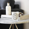 Lifestyle image of Diptyque Baies (Berries) Candle variant: 6.7 oz (Classic)