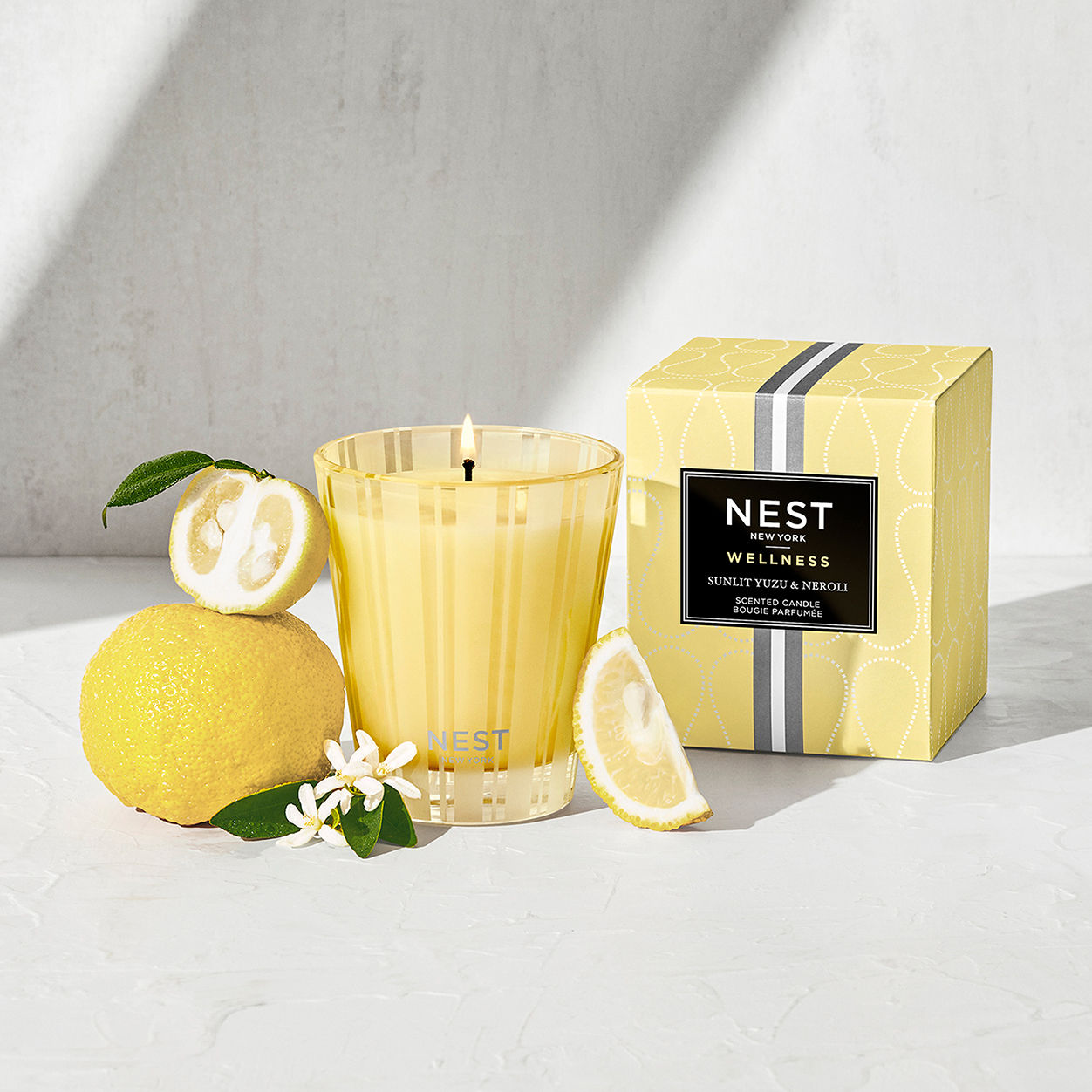 Lifestyle image of Nest Sunlit Yuzu and Neroli Candle variant: 8.1 oz (Classic)