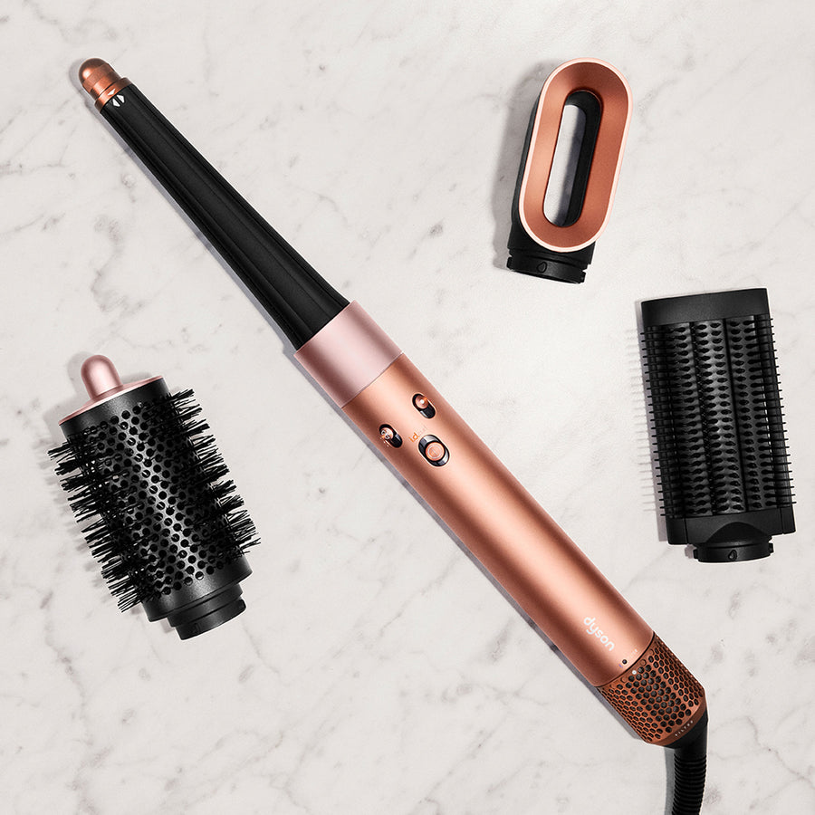 Lifestyle image of Dyson Airwrap i.d. Multi-Styler and Dryer Straight+Wavy variant: Amber Silk (Limited Edition)