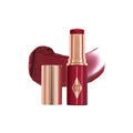 Swatch image of Charlotte Tilbury Unreal Lip + Cheek Glow Blush Stick with Hyaluronic Acid variant: Berry Glow