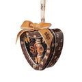 Heart-shaped tin ornament containing a Pure Silk Skinny Scrunchie Trio Ornament (Limited Edition), topped with a velvet bow and branded ribbon.