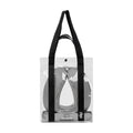 A black and white striped Slip Jet Setter Travel Pillow tucked inside a clear plastic tote bag.