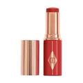 Charlotte Tilbury Unreal Lip + Cheek Glow Blush Stick with Hyaluronic Acid variant: Cherry Glow main image