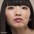 Close-up of a woman’s face wearing Bobbi Brown Skin Foundation Stick in a smooth, natural-looking finish, with the text COOL BEIGE in the bottom-left corner.