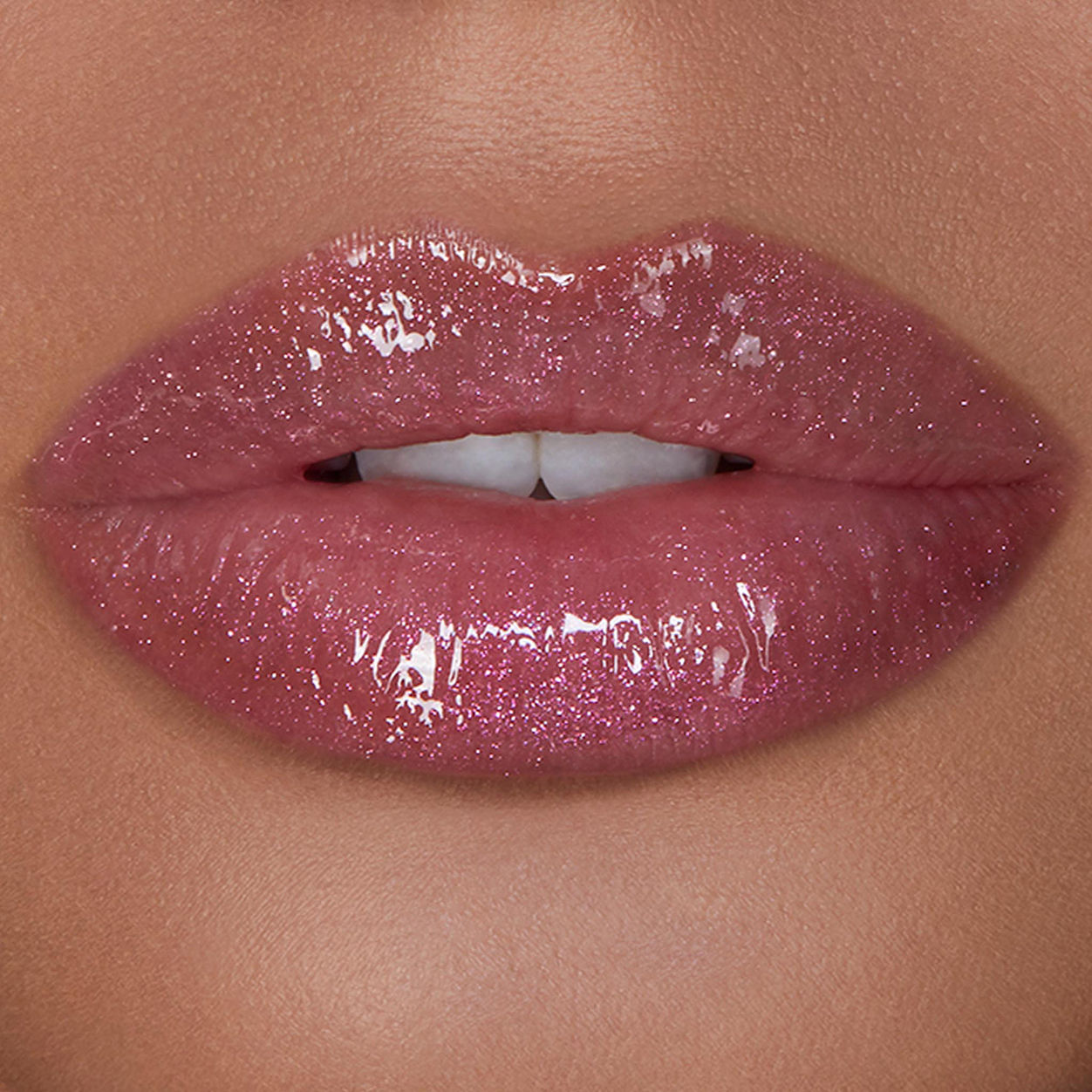 Model image of Hourglass Unreal High Shine Volumizing Lip Gloss variant: Cosmic