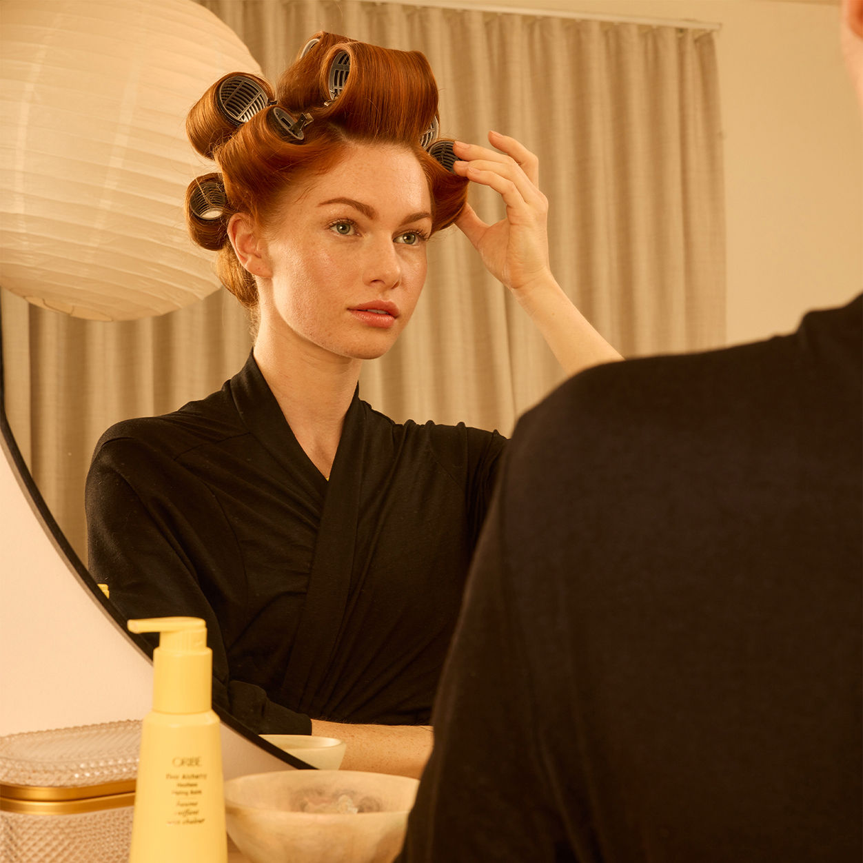 Model image of Oribe Hair Alchemy Heatless Styling Balm variant: Default Title