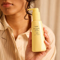 Model image of Oribe Hair Alchemy Heatless Styling Balm variant: Default Title