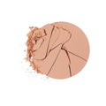 A circular Chantecaille Compact Makeup in a light-toned matte powder, cracked and crumbling at the edge.