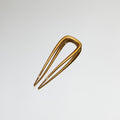 Lifestyle image of Deborah Pagani Small DP Pin variant: Gold