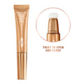 Model image of Charlotte Tilbury Beauty Light Wand variant: Goldgasm