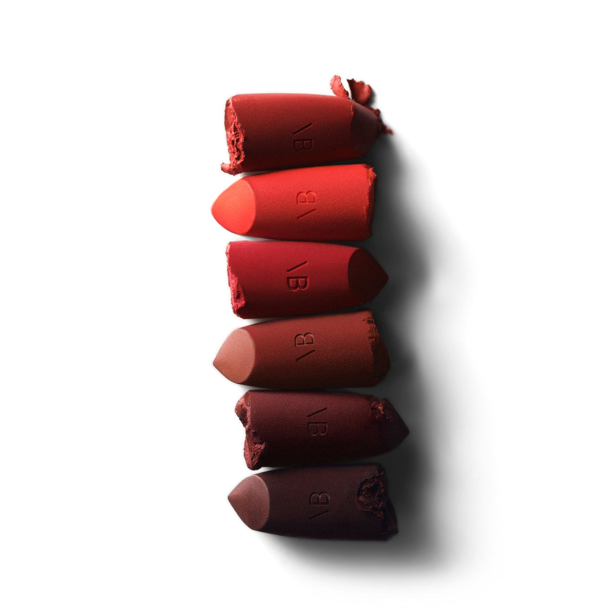 A shade comparison of   variant: House Red - A classic pure red and Victoria’s go-to for a bold red lip
