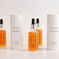 Lifestyle image of Tan-Luxe The Body Illuminating Self Tan Drops variant: Light/Medium - 1 oz