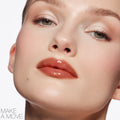 Model image of Nars Afterglow Lip Shine variant: Make a Move
