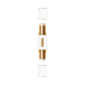 Pat McGrath Labs Skin Fetish Highlighter and Balm Duo in a gold and clear casing, shown with both caps removed to provide a scintillating glow.