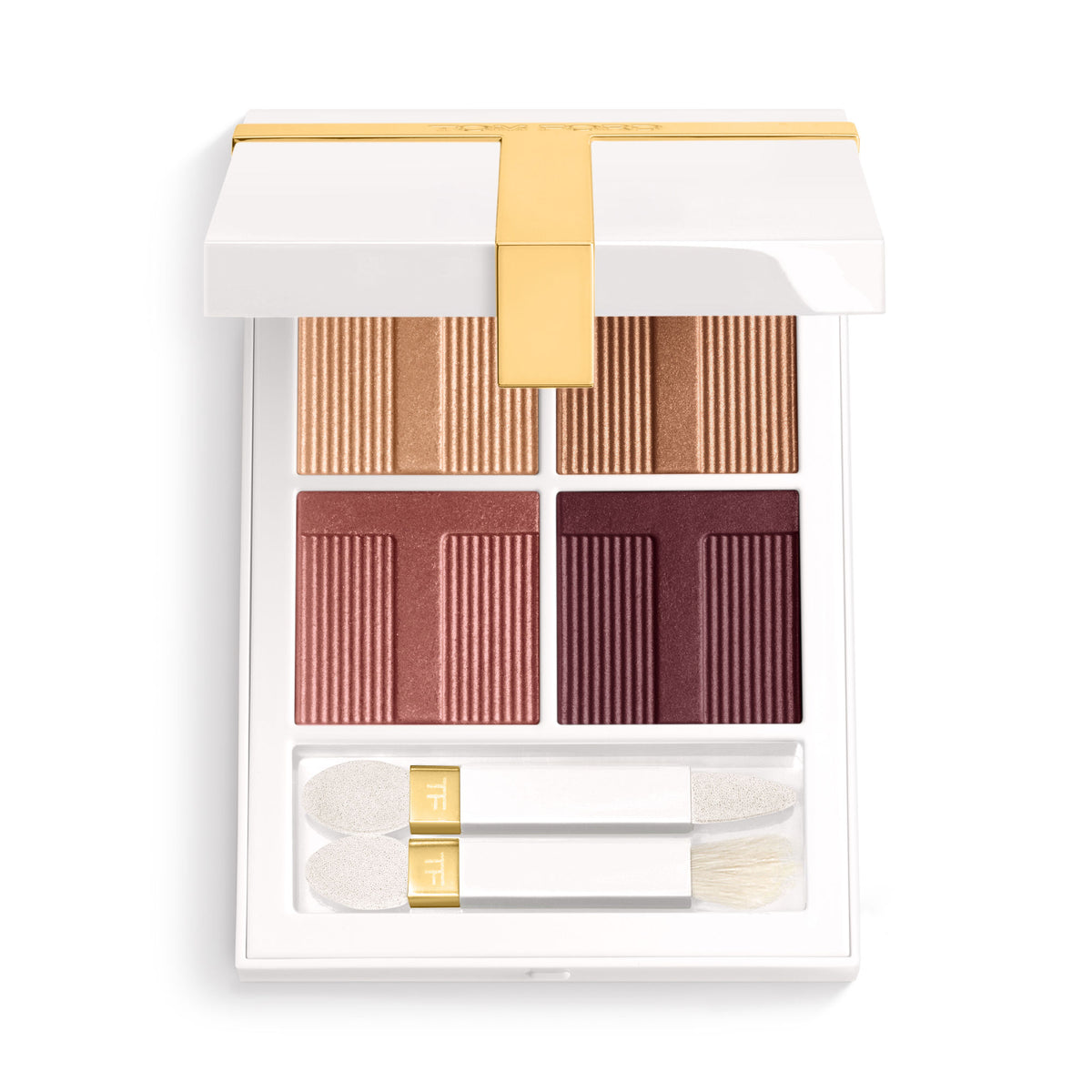 Tom Ford Soleil Eye Color Quad Lumiere Eyeshadow in a white compact featuring four silky-soft, rectangular shades in light gold, copper, mauve, and deep plum, with two included applicator brushes.