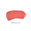 A swipe of SatinAllure Lipstick in PETALLICA coral-pink, offering a weightless, silky smooth color.
