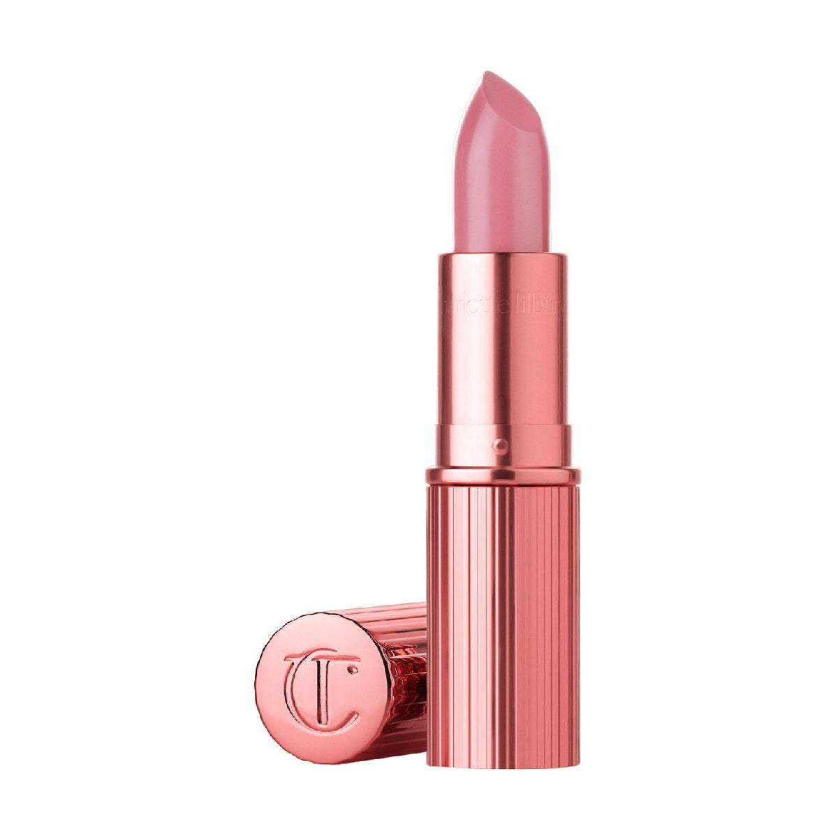 Open tube of Charlotte Tilbury K.I.S.S.I.N.G. Lipstick in a long-lasting pink shade with a metallic rose-gold casing and its matching cap lying beside it.