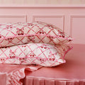 Lifestyle image of Slip Pure Silk Queen Pillowcase with Lace Trim (Limited Edition) variant: Sweet Cherry