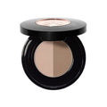 Anastasia Beverly Hills Brow Powder Duo in a round black compact containing light beige and medium brown dual-shade powder to create a natural-looking ombré effect.