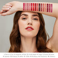 A woman displays fifteen numbered satin finish ColorLuxe Hydrating Cream Lipstick swatches on her arm, with a key listing the corresponding color names below.