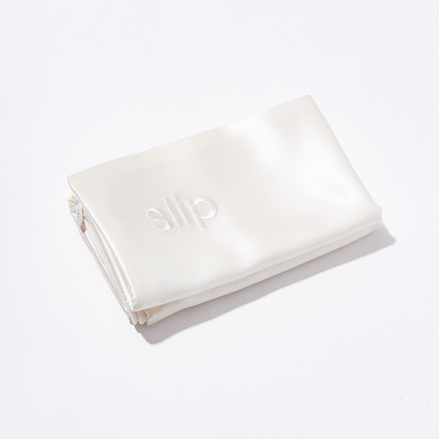 Image of an open Slip Pure Silk Queen Pillowcase variant: White