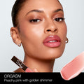 Nars Afterglow Lip Shine Color/Shade variant: Orgasm model image 3 . This product is in the color pink